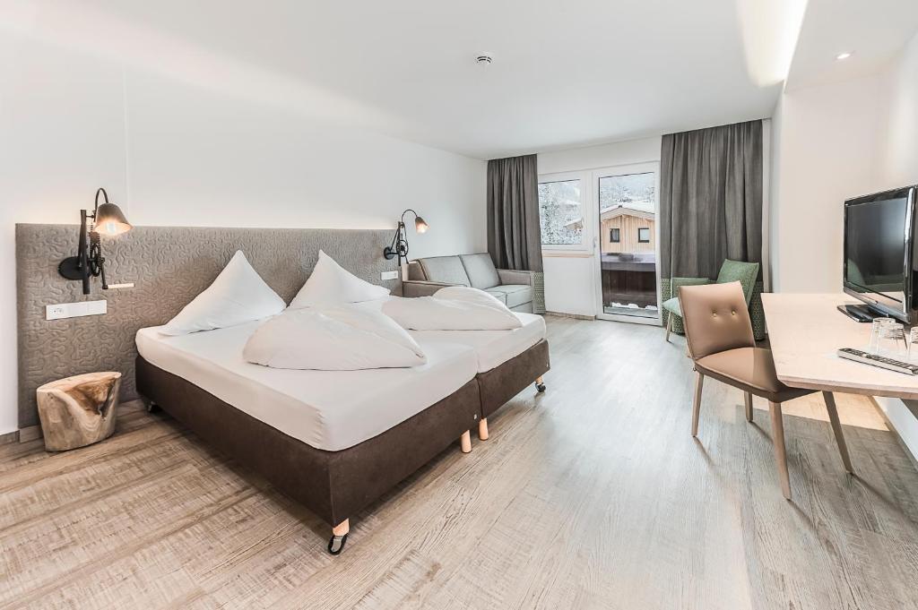 Postel nebo postele na pokoji v ubytování Lifesport Hotel Hechenmoos