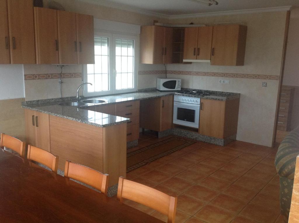 Kuchyň nebo kuchyňský kout v ubytování Casa As Pedreiras