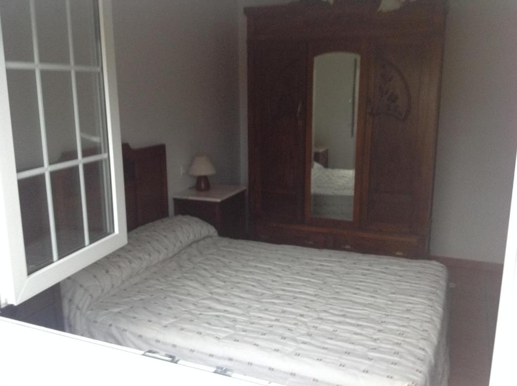 Postel nebo postele na pokoji v ubytování Casa As Pedreiras