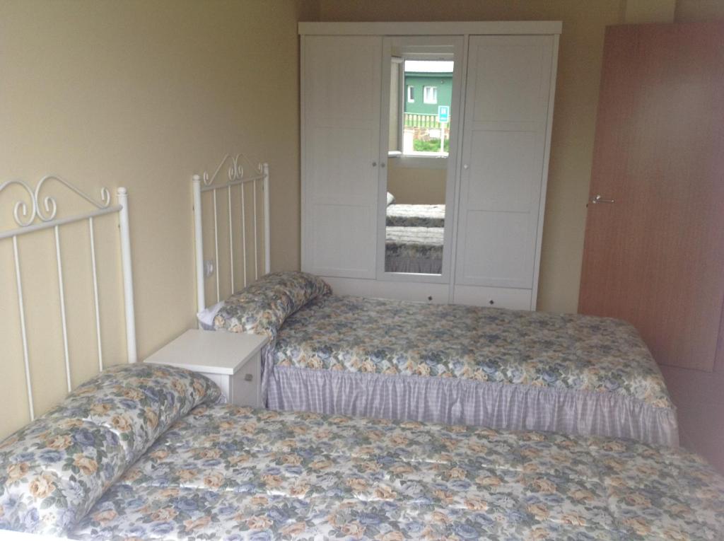 Postel nebo postele na pokoji v ubytování Casa As Pedreiras
