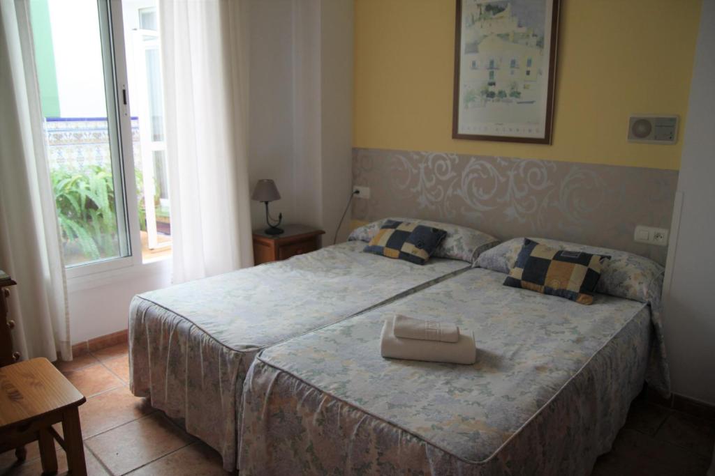 Postel nebo postele na pokoji v ubytování Hostal Ana - Adults Recommended