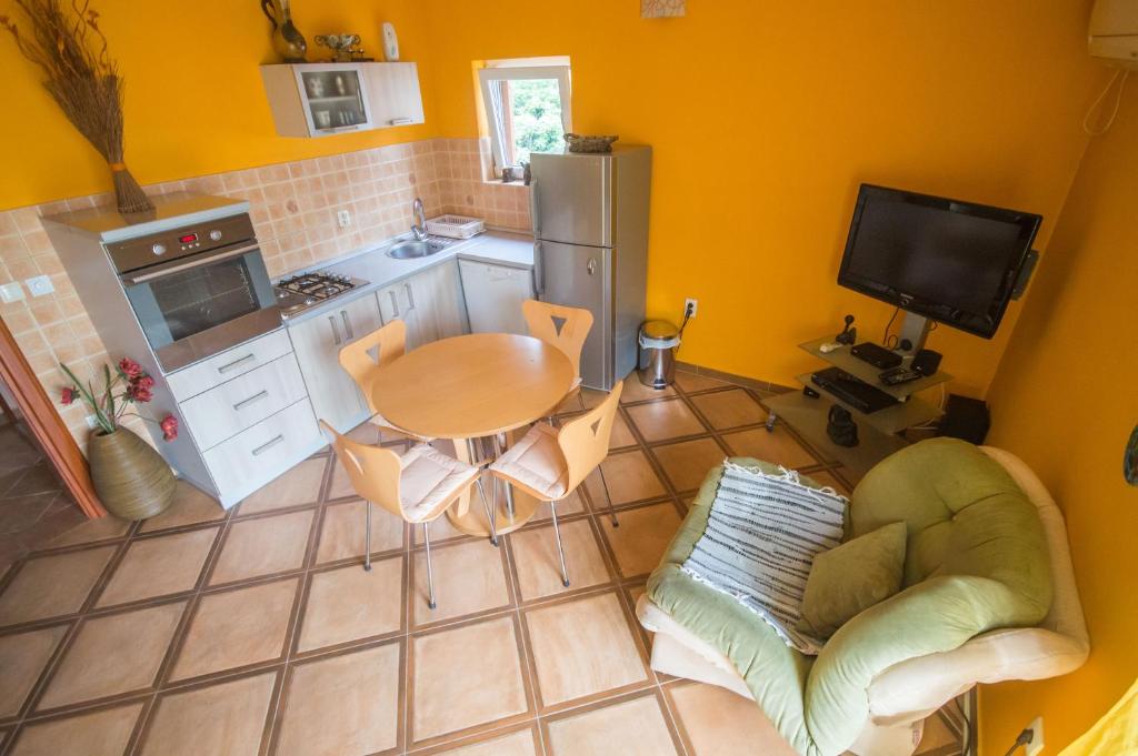 an overhead view of a kitchen with a table and chairs at Apartments Ćuković in Risan