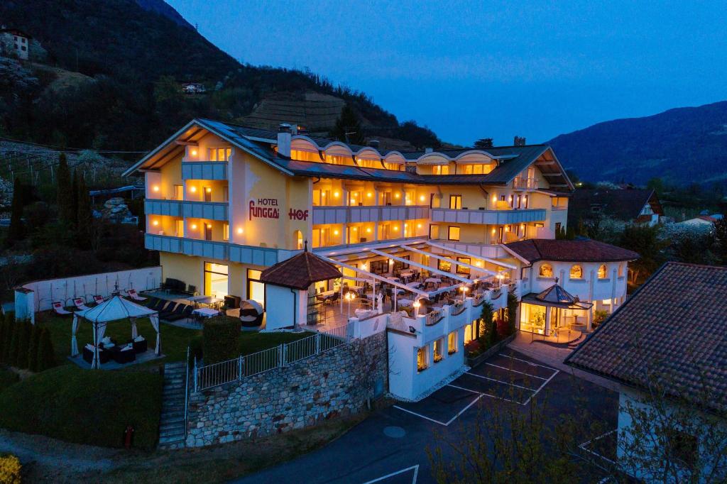 an aerial view of a hotel at night at Hotel Funggashof in Naturno