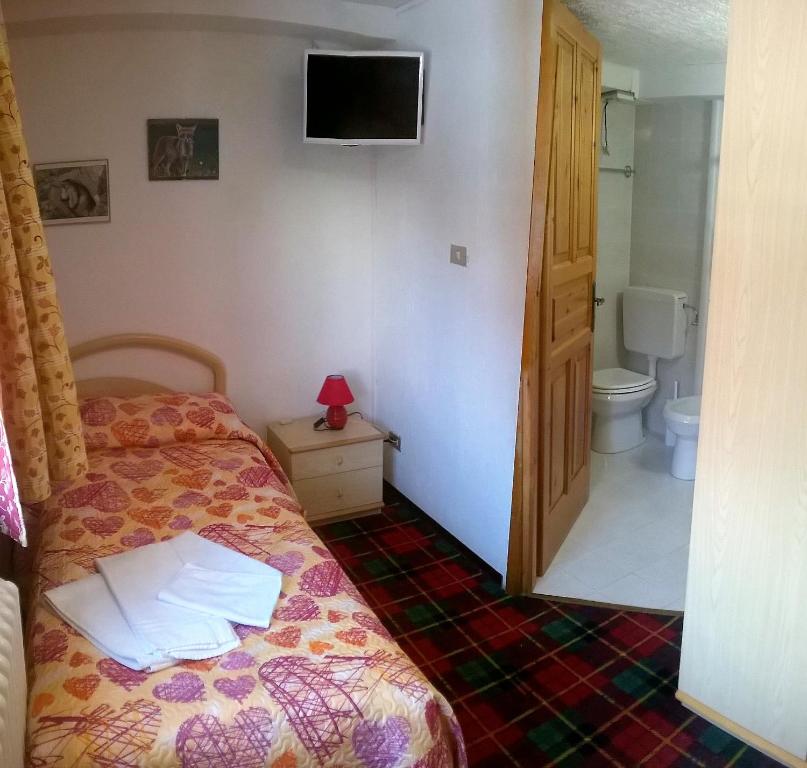 Postel nebo postele na pokoji v ubytování Hotel Paradisia