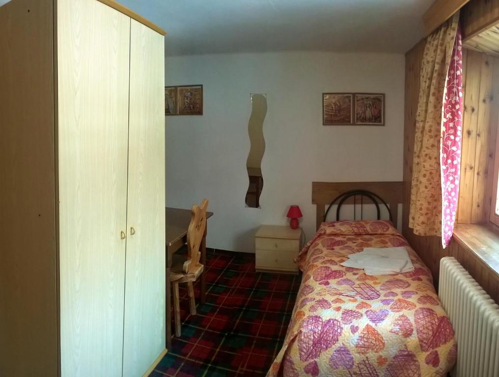 Postel nebo postele na pokoji v ubytování Hotel Paradisia