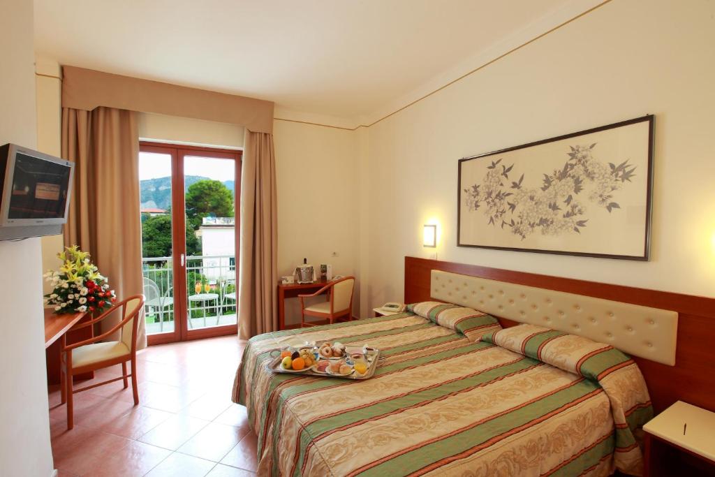 Postel nebo postele na pokoji v ubytování Hotel Caravel