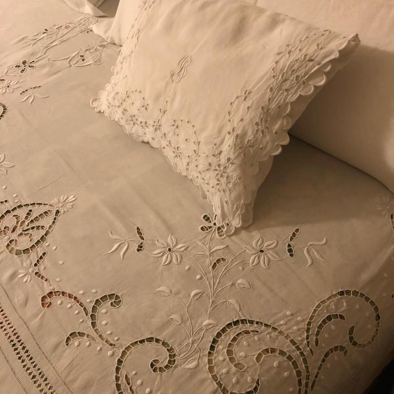 Postel nebo postele na pokoji v ubytování Le Case Di San Vitale