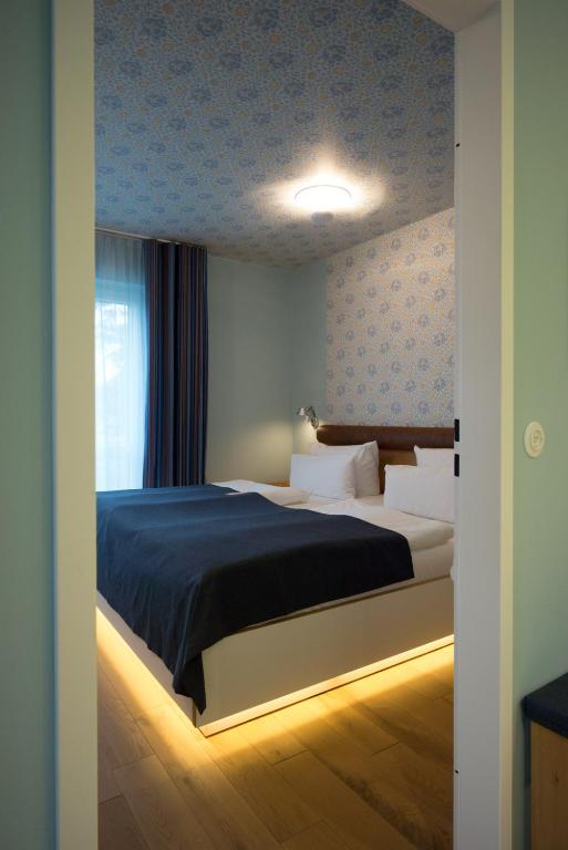 Postel nebo postele na pokoji v ubytování Hotel Gude