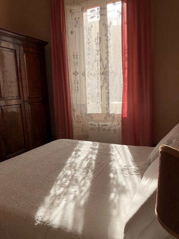 Postel nebo postele na pokoji v ubytování Le Case Di San Vitale