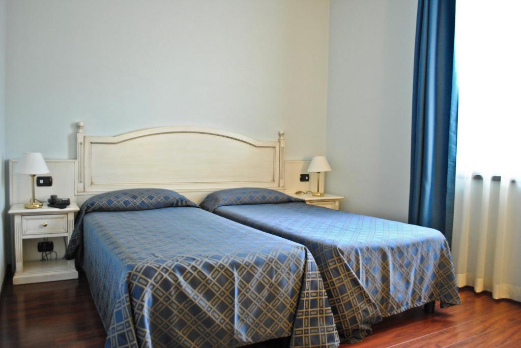 Postel nebo postele na pokoji v ubytování International Hotel