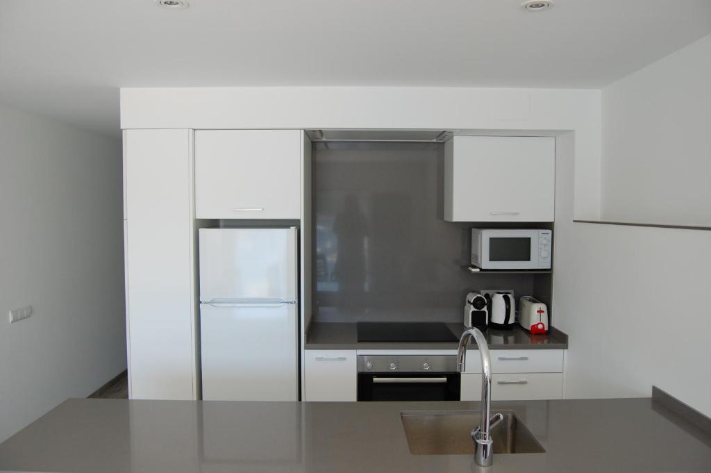 Kuchyň nebo kuchyňský kout v ubytování Apartament Cortey