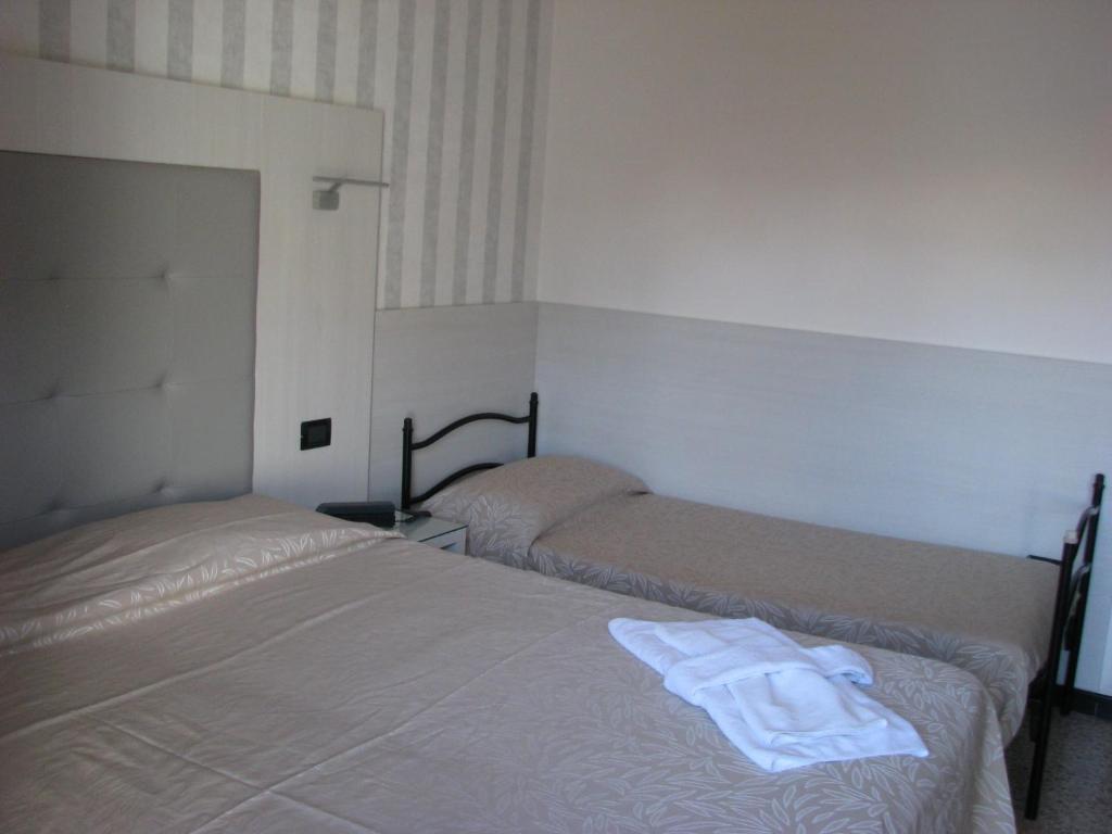 Postel nebo postele na pokoji v ubytování Hotel Fabius