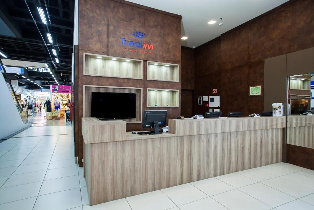 a lobby of a store with a reception desk at Travel Inn Bras in Sao Paulo