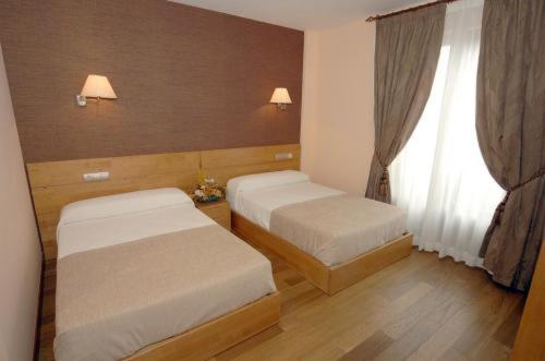 Postel nebo postele na pokoji v ubytování Hotel O Desvio