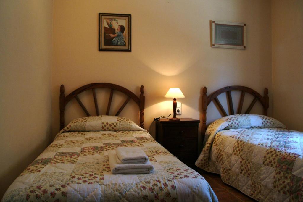 En eller flere senge i et værelse på Casa Labata