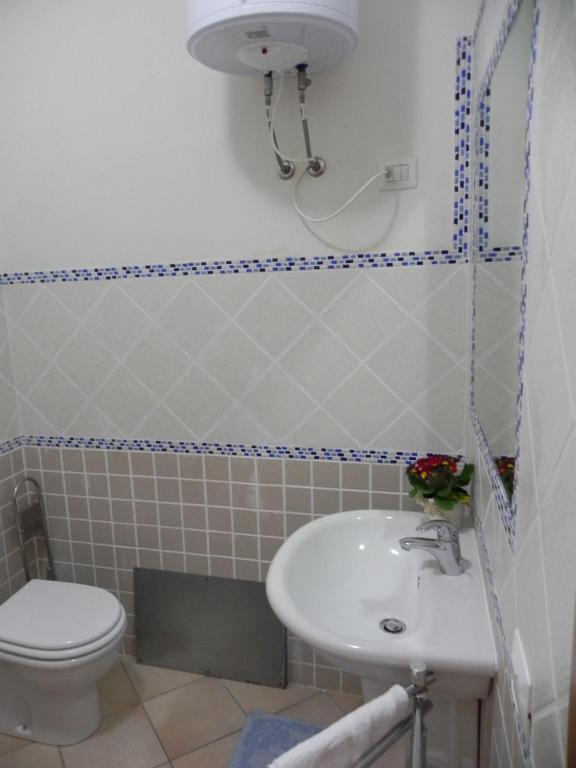 Koupelna v ubytování Buggerru a Mare Residence