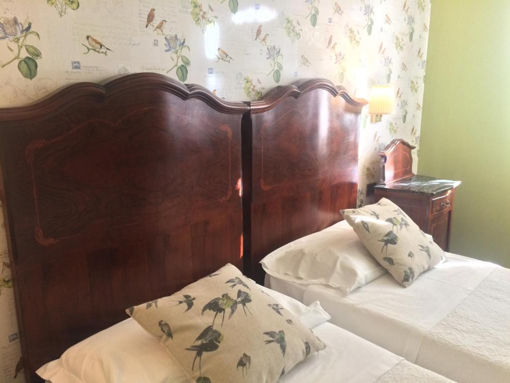 Postel nebo postele na pokoji v ubytování Albergo & Ristorante Selvatico