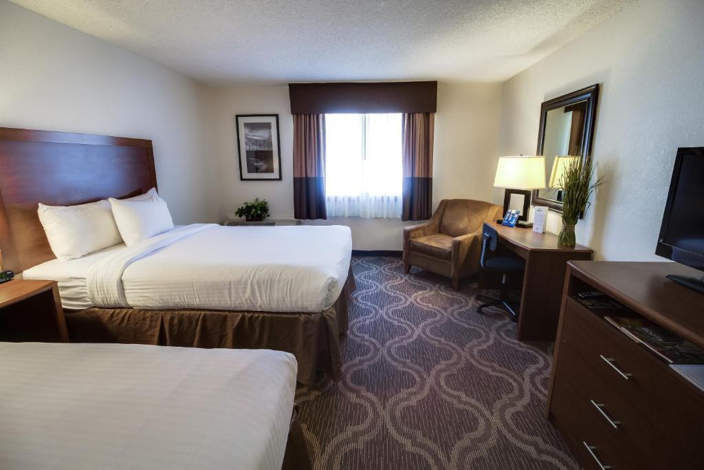 Postel nebo postele na pokoji v ubytování Ashmore Inn and Suites Lubbock