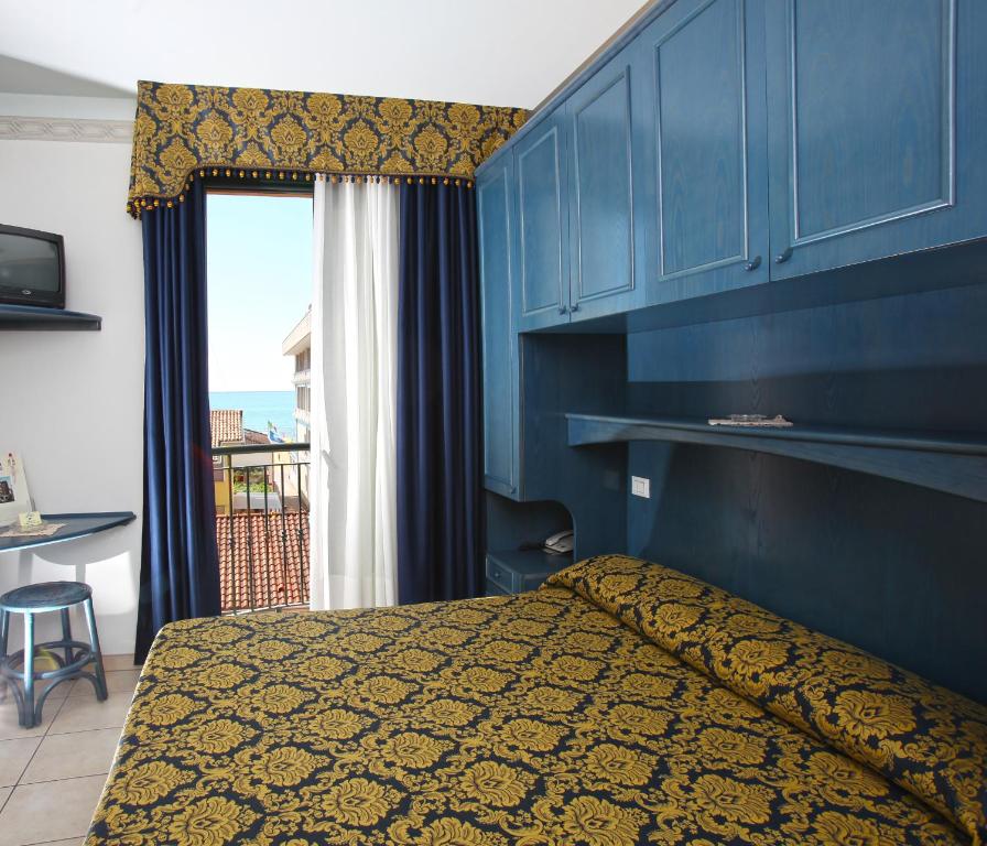 Postel nebo postele na pokoji v ubytování Hotel Garni San Carlo