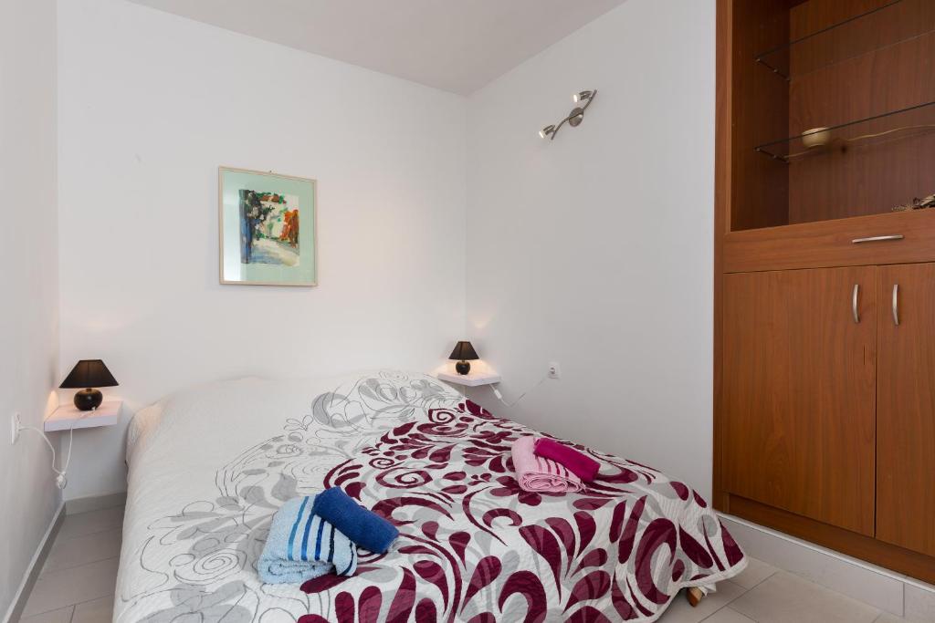 Кровать или кровати в номере Apartments Luna