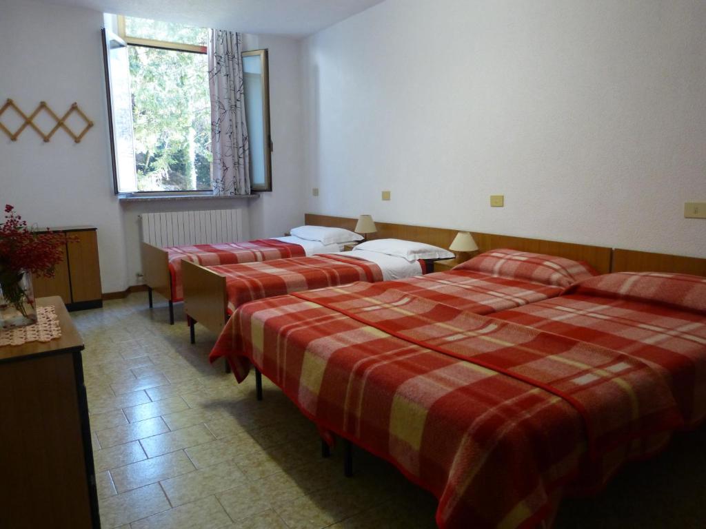 Postel nebo postele na pokoji v ubytování Ostello Al Deserto