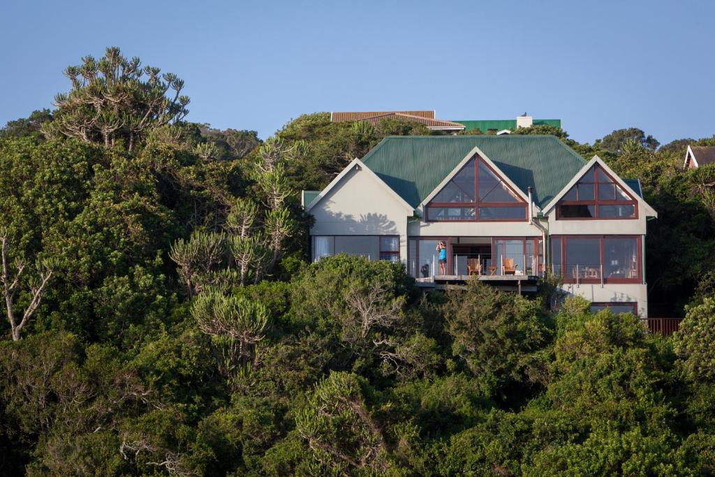 a house on top of a hill with trees at Westend House in Seafield