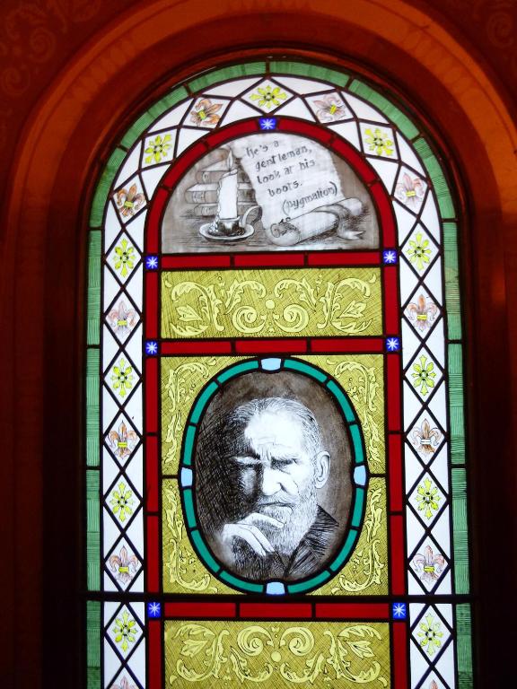 a stained glass window with a portrait of a man at Harcourt Hotel in Dublin