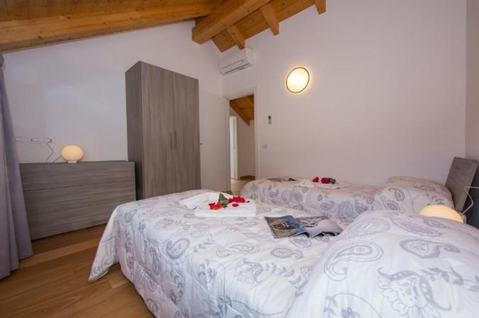 Llit o llits en una habitació de Paradiso del lago