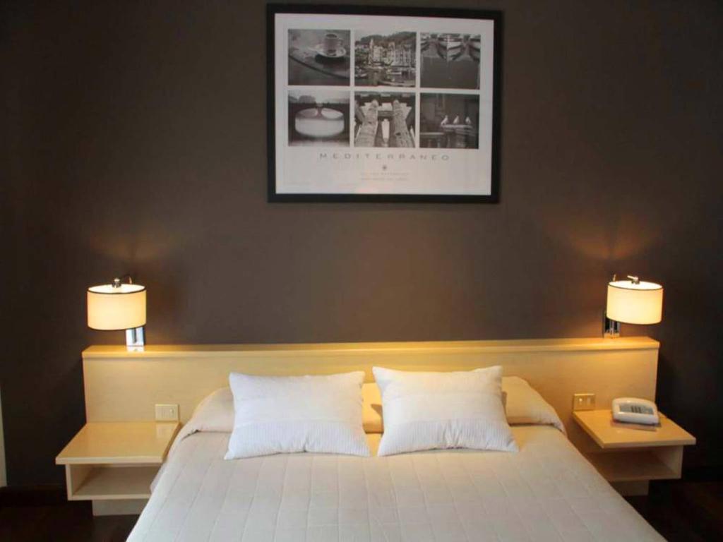 Postel nebo postele na pokoji v ubytování Hotel Ancora Riviera