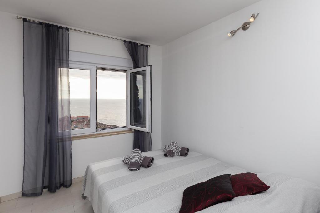 Кровать или кровати в номере Apartments Luna