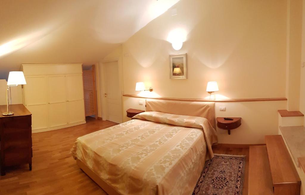 Postel nebo postele na pokoji v ubytování Relais Villa Selle