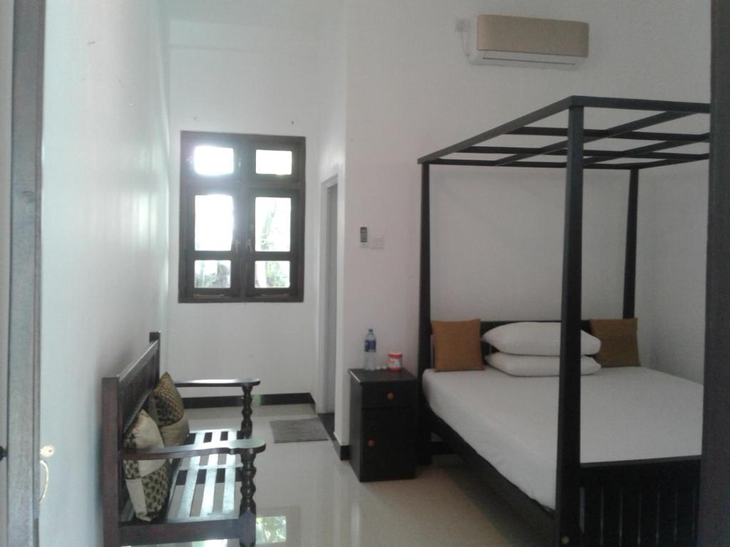 Postel nebo postele na pokoji v ubytování Apna Homestay Apartments
