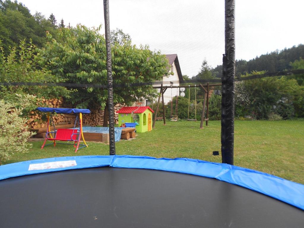 a view of a playground with a trampoline at ubytování v apartmánu in Mladkov