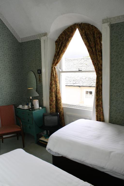 Postel nebo postele na pokoji v ubytování Woodhill House