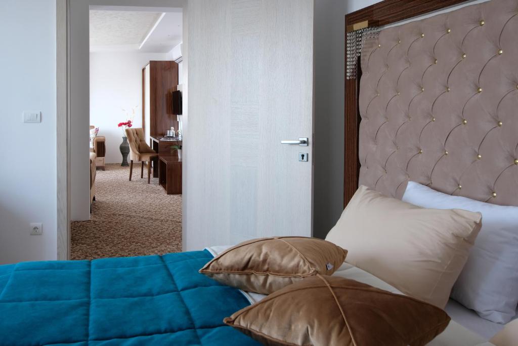 Postel nebo postele na pokoji v ubytování New Hotel