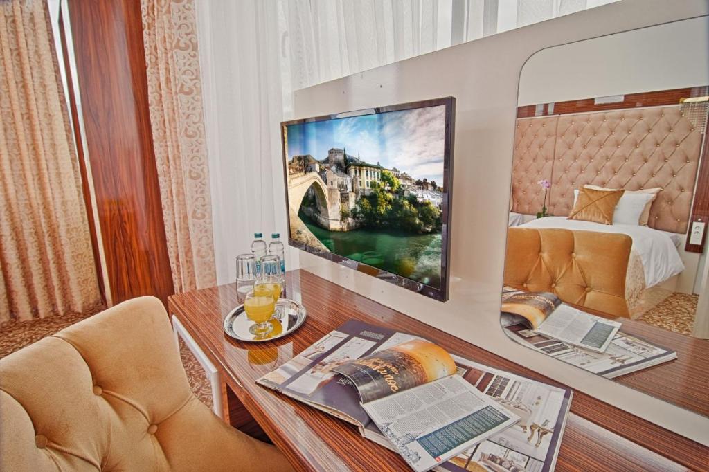 TV a/nebo společenská místnost v ubytování New Hotel