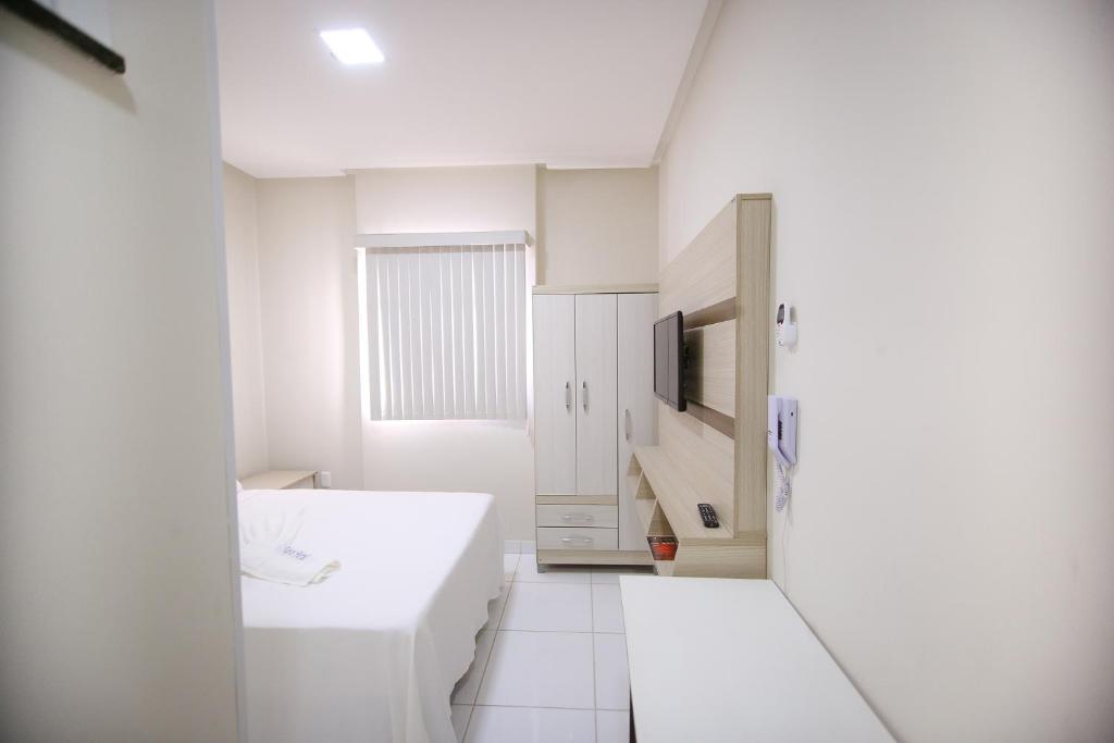 Postel nebo postele na pokoji v ubytování O Neves Hotel