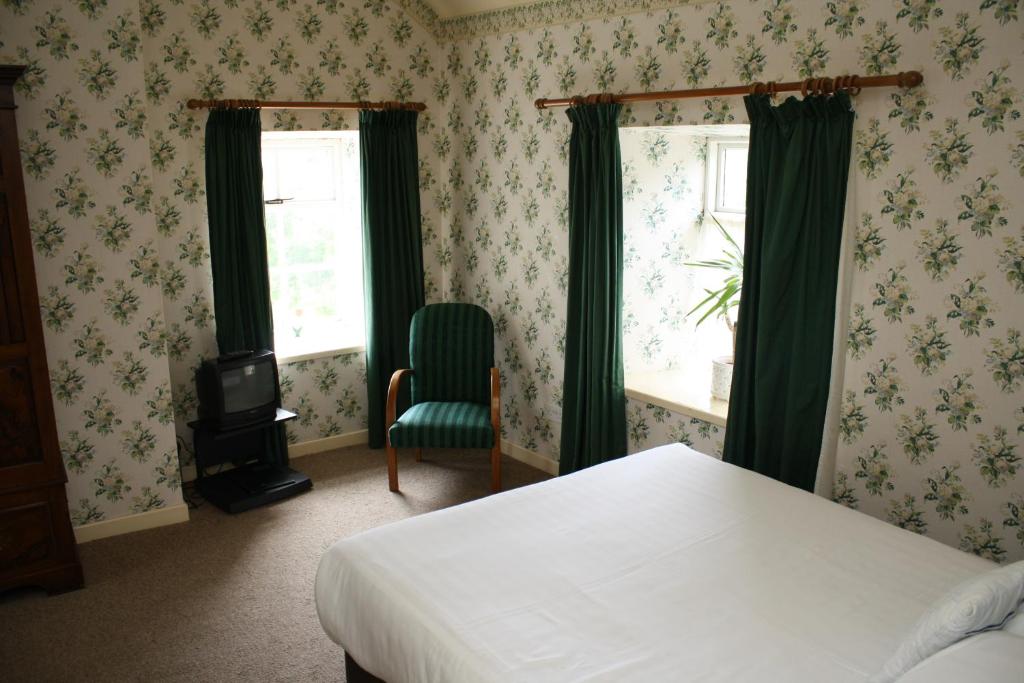 Postel nebo postele na pokoji v ubytování Woodhill House