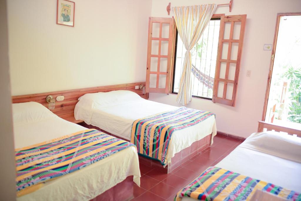 Ένα ή περισσότερα κρεβάτια σε δωμάτιο στο Hotel and Restaurant Guancascos