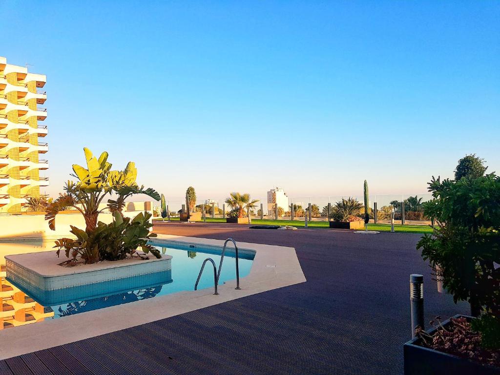 a swimming pool in the middle of a building at Ático de lujo en el centro in Aguadulce