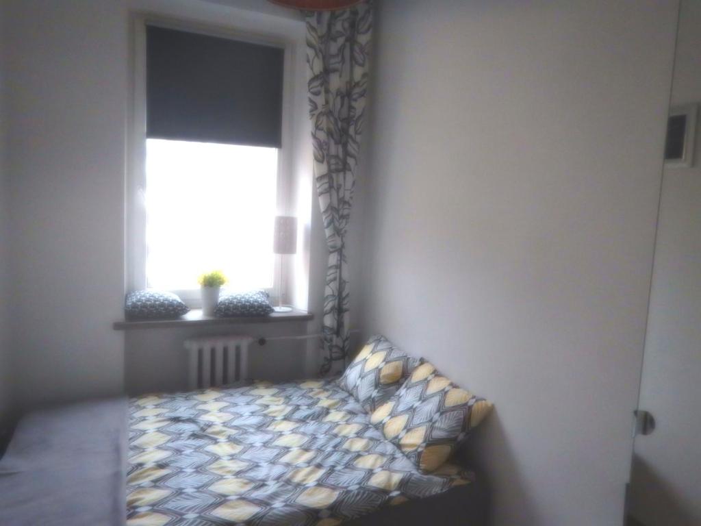 Posteľ alebo postele v izbe v ubytovaní Central Warsaw Apartment