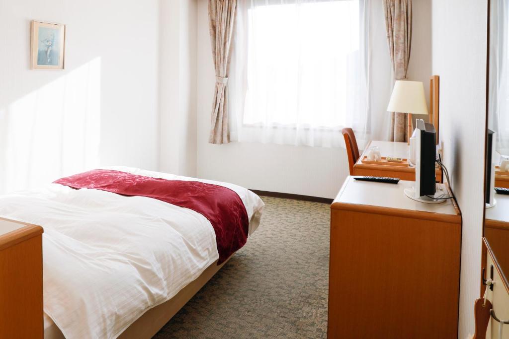 Postel nebo postele na pokoji v ubytování Gran Hotel