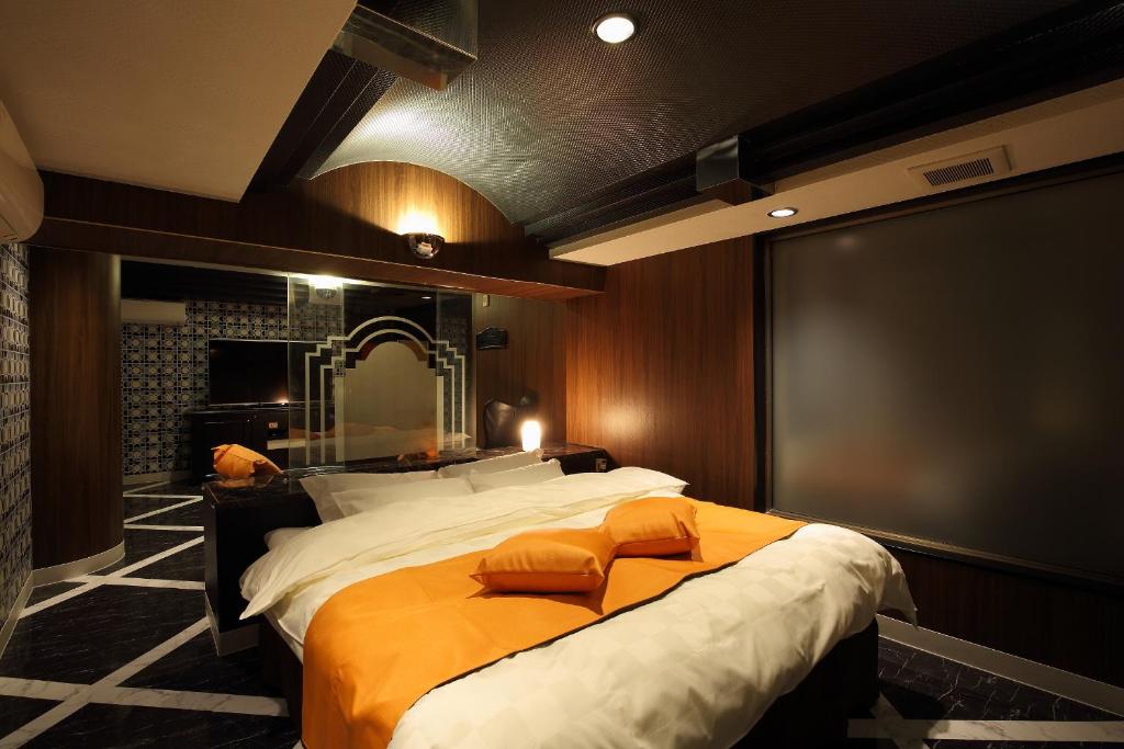 Säng eller sängar i ett rum på Himeji Park Hotel (Adult Only)