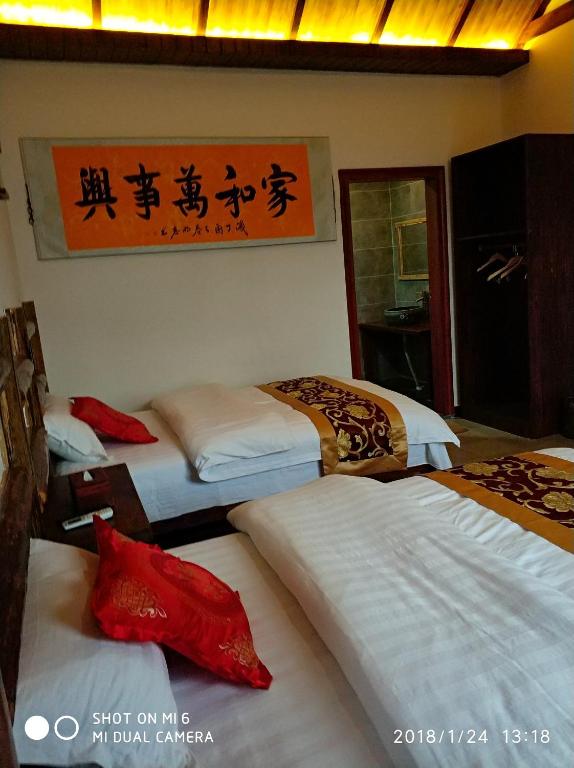 Postel nebo postele na pokoji v ubytování Tian Jia Xiao Yuan Boutique Homestay