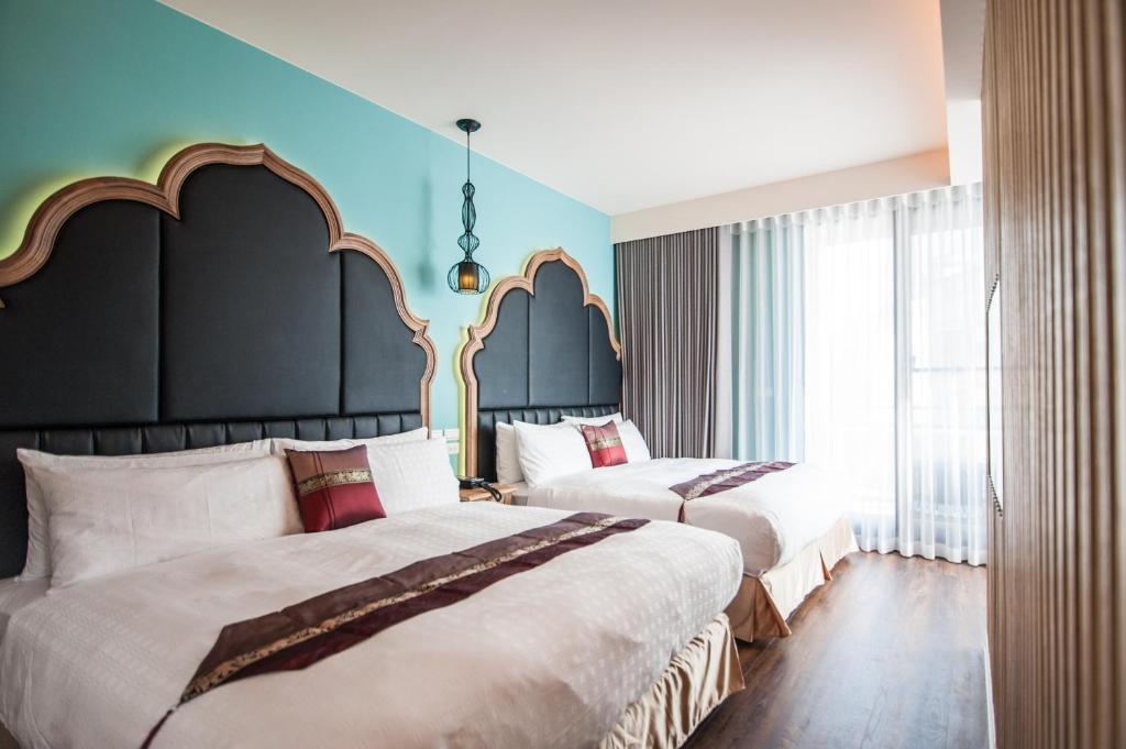 A bed or beds in a room at Dreamer Boutique Hotel