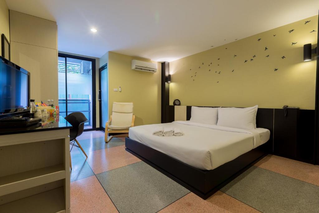 Postel nebo postele na pokoji v ubytování Pen Ta Hug Hotel