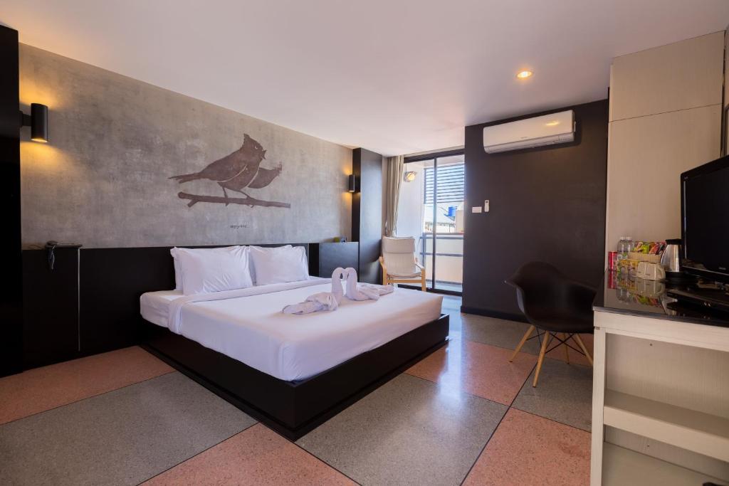 Postel nebo postele na pokoji v ubytování Pen Ta Hug Hotel