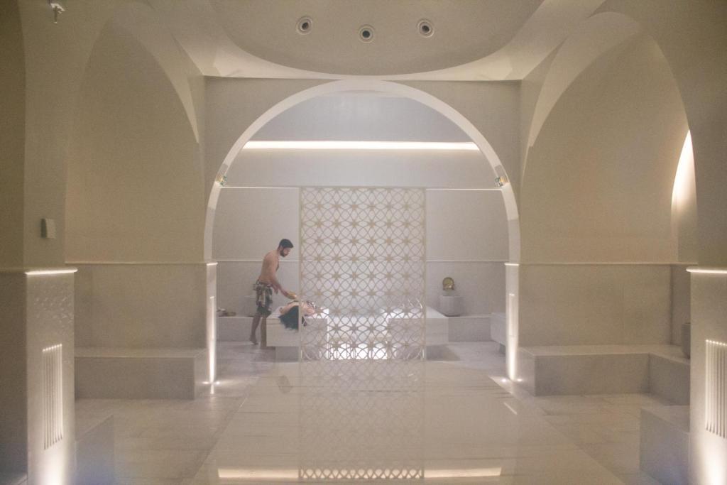 a man standing in an archway in a building at Makedonia Palace in Thessaloniki
