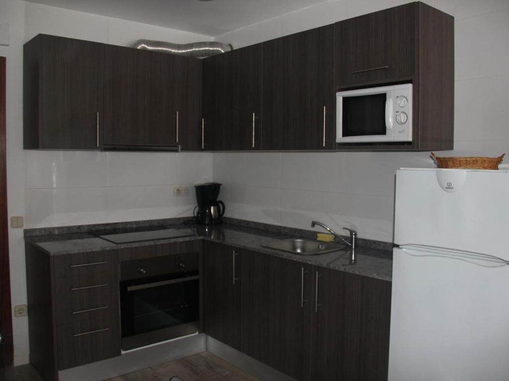 Kuchyň nebo kuchyňský kout v ubytování VicAm Atico Duplex