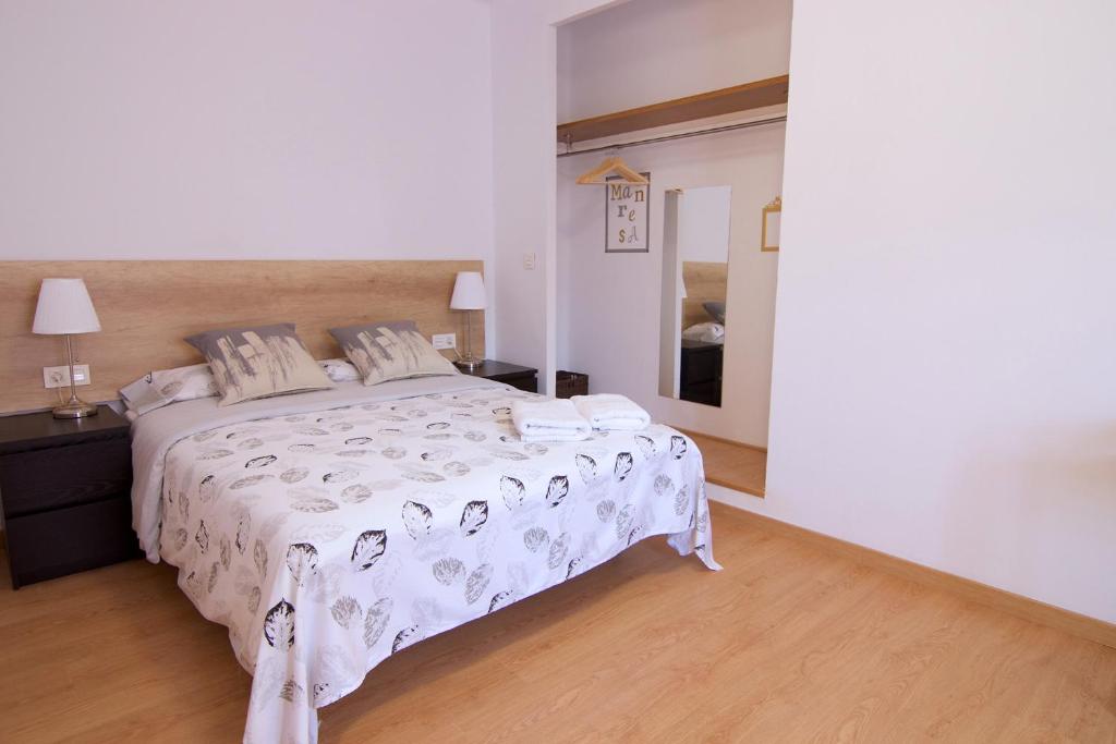 Postel nebo postele na pokoji v ubytování Apartaments IXA